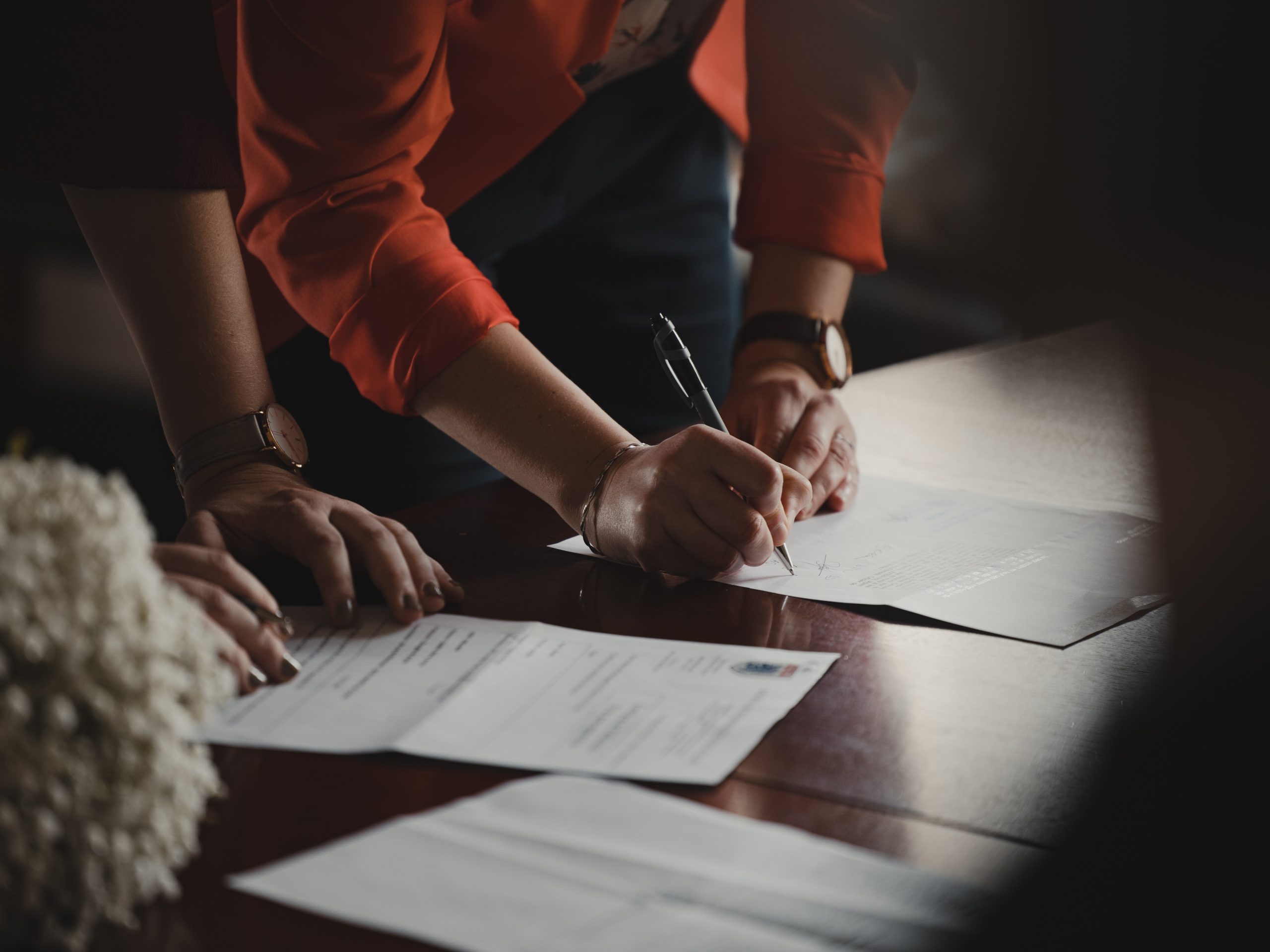 woman signing a prenuptial agreement in texas